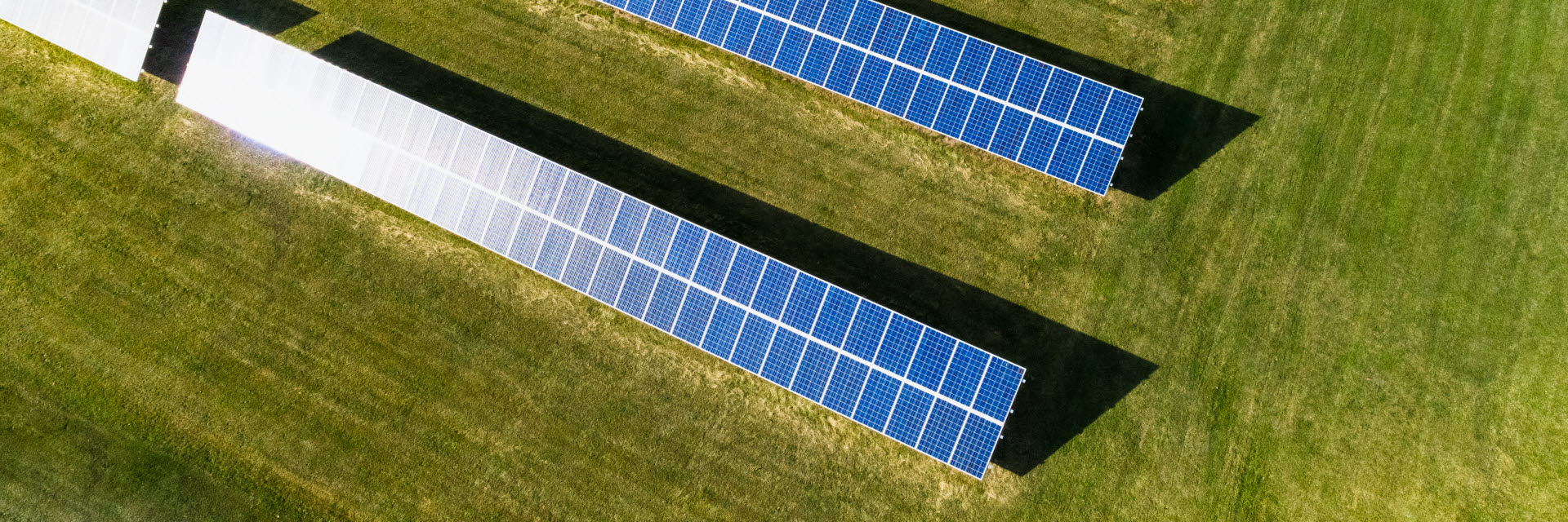 Rows of solar panels in a meadow, Österåker, Stockholm.
